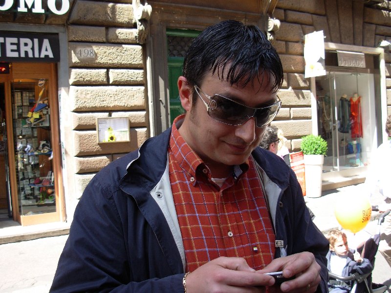 TRINACRIA is playing with his mobile phone.
